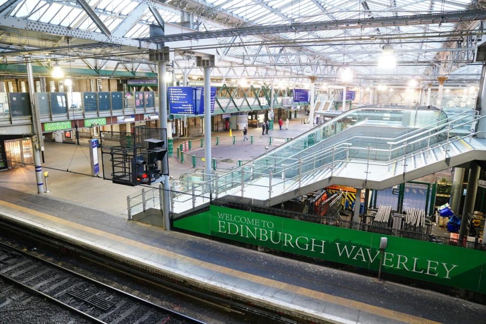 Following the impact of Storm Isha, the UK is now facing Storm Jocelyn with severe weather leading Scot Rail to suspend services until at least noon on Tuesday - here’s the scene at  Edinburgh Waverley train station (PA)