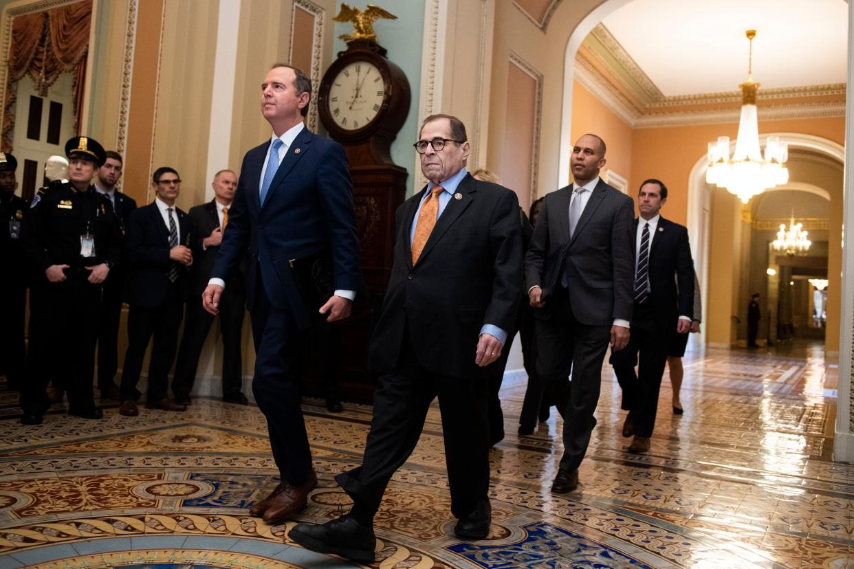 Impeachment managers arrive at the Senate to read the articles of impeachment on Thursday, led by Reps. Adam Schiff (D-Calif.), left, and Jerrold Nadler (D-N.Y.). (Tom Williams via Getty Images)