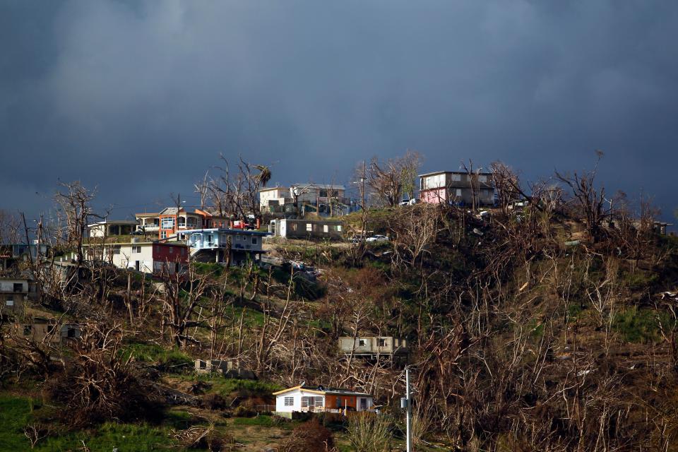 Damaged houses are seen atop a hill in the aftermath of Hurricane Maria in Yabucoa, Puerto Rico, on Oct. 2, 2017. (Photo: RICARDO ARDUENGO via Getty Images)