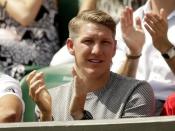 Footballer Bastian Schweinsteiger watches Ana Ivanovic of Serbia during her match against Yi-Fan Xu of China at the Wimbledon Tennis Championships in London, June 29, 2015. REUTERS/Henry Browne