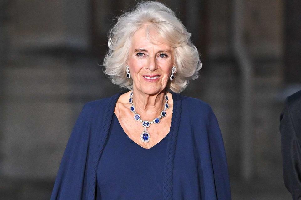 <p>Stephane Cardinale - Corbis/Corbis via Getty Images</p> Queen Camilla arrives at the Palace of Versailles ahead of the state dinner on Sept. 20. 2023