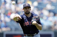 Boston Red Sox pitcher Nathan Eovaldi throws to first base for an out after fielding a ground ball from Kansas City Royals' Carlos Santana in the third inning of a baseball game at Kauffman Stadium in Kansas City, Mo., Sunday, June 20, 2021. (AP Photo/Colin E. Braley)