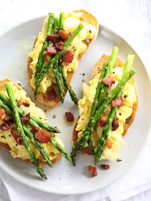 <p>This is a simple but elegant brunch option everyone will love!</p><p><a href="http://www.foodiecrush.com/scrambled-egg-and-roasted-asparagus-toasts/" rel="nofollow noopener" target="_blank" data-ylk="slk:Get the recipe here!;elm:context_link;itc:0;sec:content-canvas" class="link rapid-noclick-resp"><em><strong>Get the recipe here!</strong></em></a></p>