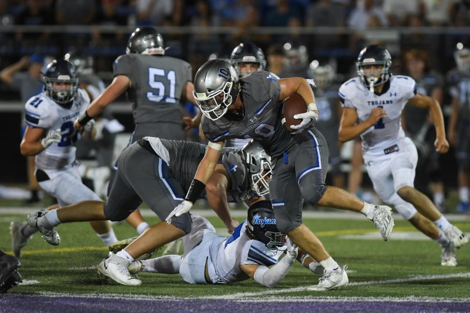 SF Christian's Brayden Witte (10) avoids getting tackled by a West Central player at USF Sports Complex in Sioux Falls, South Dakota on Friday, Sept. 1, 2023.