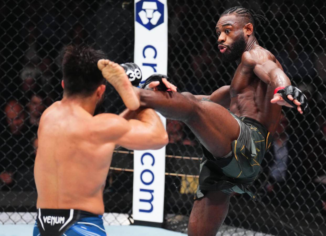 NEWARK, NEW JERSEY - MAY 06: (R-L) Aljamain Sterling kicks Henry Cejudo in the UFC bantamweight championship fight during the UFC 288 event at Prudential Center on May 06, 2023 in Newark, New Jersey. (Photo by Chris Unger/Zuffa LLC via Getty Images)