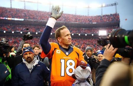 Jan 24, 2016; Denver, CO, USA; Denver Broncos quarterback Peyton Manning (18) waves to the crowd after the AFC Championship football game against the New England Patriots at Sports Authority Field at Mile High. Mandatory Credit: Mark J. Rebilas-USA TODAY Sports