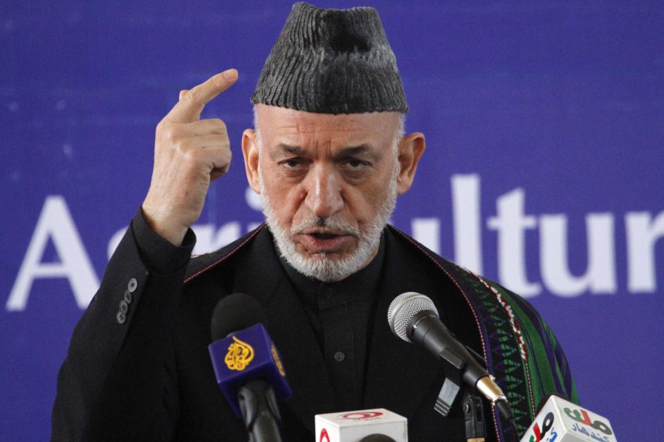 Afghan President Hamid Karzai speaks at the inauguration ceremony of the Afghan National Agriculture Science and Technology University accompanied by Indian Foreign Minister Salman Khurshid, in Kandahar province south of Kabul, Afghanistan, Saturday, Feb. 15, 2014. A total 4.5 million U.S. dollars has been spent by the government of India in building the university. (AP Photo/Allauddin Khan)