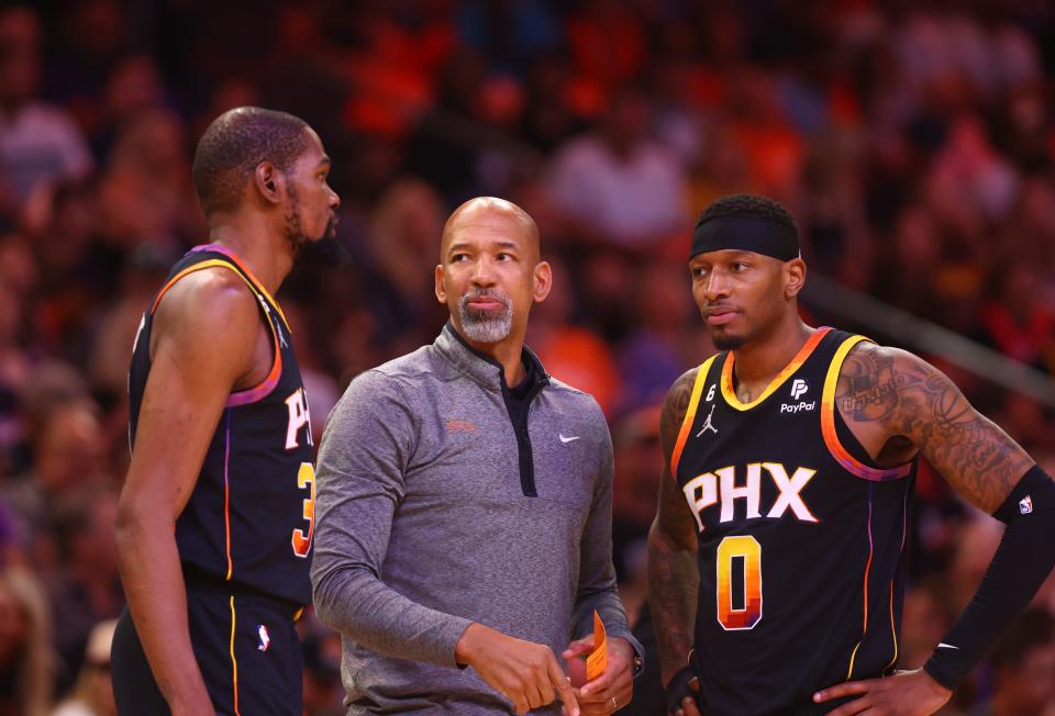 Phoenix Suns head coach Monty Williams with forwards Kevin Durant, left, and Torrey Craig during Game 5 of the first-round playoff series vs. the LA Clippers at Footprint Center in Phoenix, April 25, 2023.