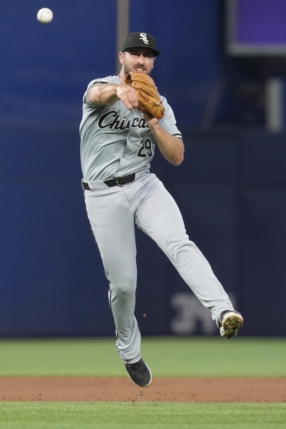 Chicago White Sox shortstop Paul DeJong throws to first base for an out during the second inning of a baseball game against the Miami Marlins, Saturday, July 6, 2024, in Miami. (AP Photo/Marta Lavandier)