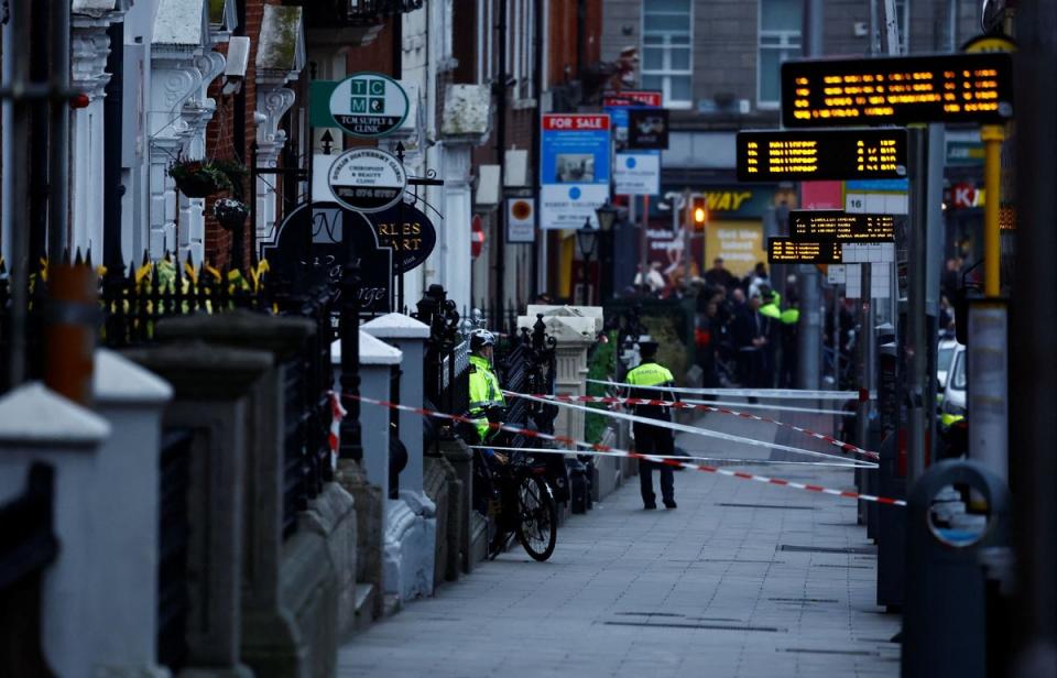 Police officers work near the scene of the stabbing on Thursday (REUTERS)