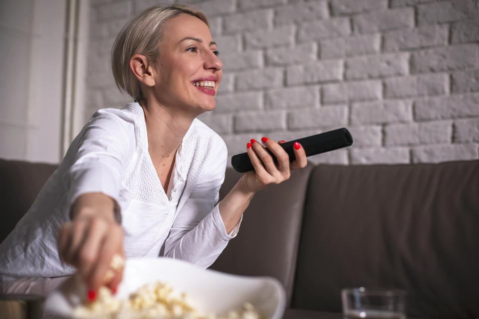 Woman in pyjamas watching movies (Photo: Getty Images)