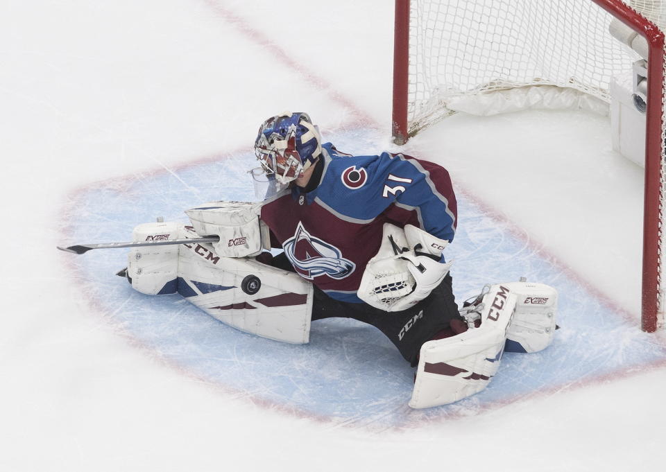 Colorado Avalanche goalie Philipp Grubauer (31) makes the save during the first period of an NHL Stanley Cup qualifying round game in Edmonton, Alberta, Saturday, Aug. 8, 2020. (Jason Franson/The Canadian Press via AP)