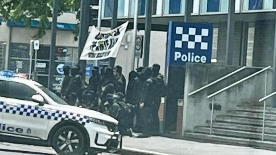 The group were seen posing and taking photos in front of the Ballarat Police Station. Photo: Twitter