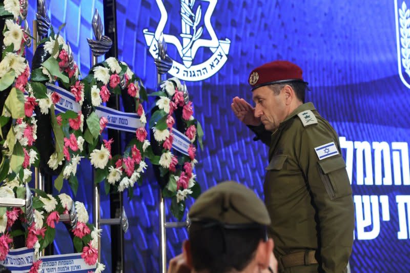 Israeli army chief Herzi Halevi salutes during a wreath-laying ceremony marking national Memorial Day for fallen soldiers of Israel's wars and victims of attacks at Jerusalem's Mount Herzl military cemetery on Monday. Pool Photo by Gil Cohen-Magen/UPI