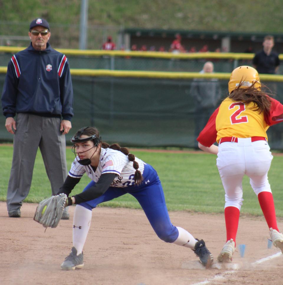 Cambridge's Paige Lagneaux comes over to cover first and holds onto the ball as a Creek runner is called out.