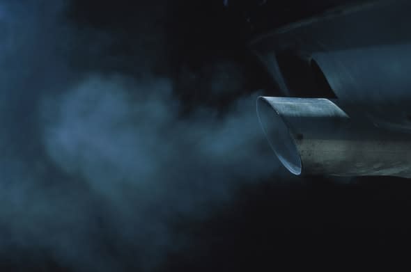 a exhaust pipe of a car emitting fumes