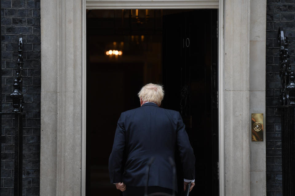 Boris Johnson enters his official residence at No. 10 Downing St.