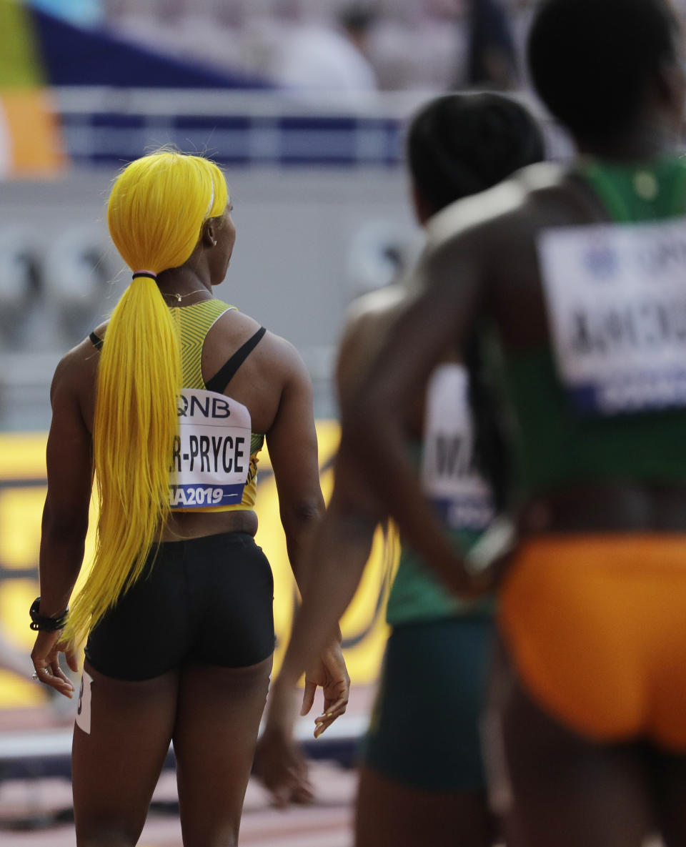 Shelly-Ann Fraser-Pryce, of Jamaica, cools down after finishing a women's 100 meter heat at the World Athletics Championships in Doha, Qatar, Saturday, Sept. 28, 2019. (AP Photo/Nariman El-Mofty)