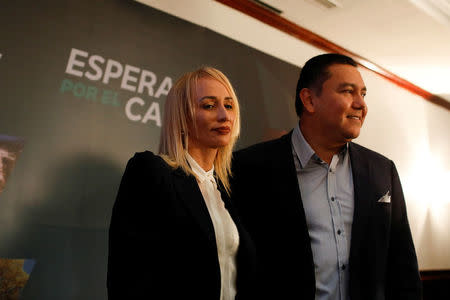 Venezuelan evangelical pastor and presidential pre-candidate Javier Bertucci (R) and his wife Rebeca de Bertucci pose for a photo after a news conference in Caracas, Venezuela, February 21, 2018. REUTERS/Marco Bello