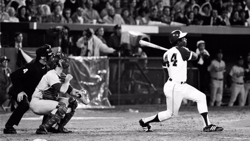 ** FILE ** Atlanta Braves' Hank Aaron (44) breaks Babe Ruth's record for career home runs as he hits