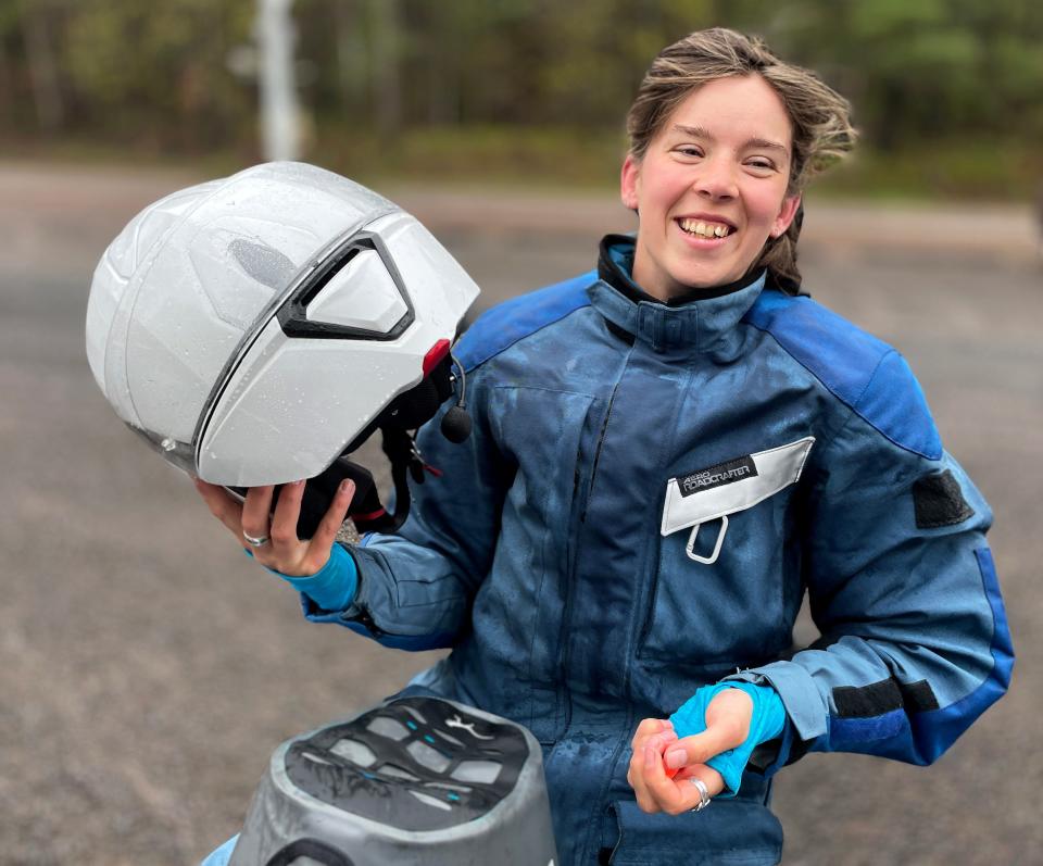 Bridget McCutchen, 21, is shown Thursday, May 26, 2022, in rural Ashland County, Wis. McCutchen, 21, is seeking to become the youngest person to ride a motorcycle around the world. She plans on leaving Aug. 10 and it will take a year or more.