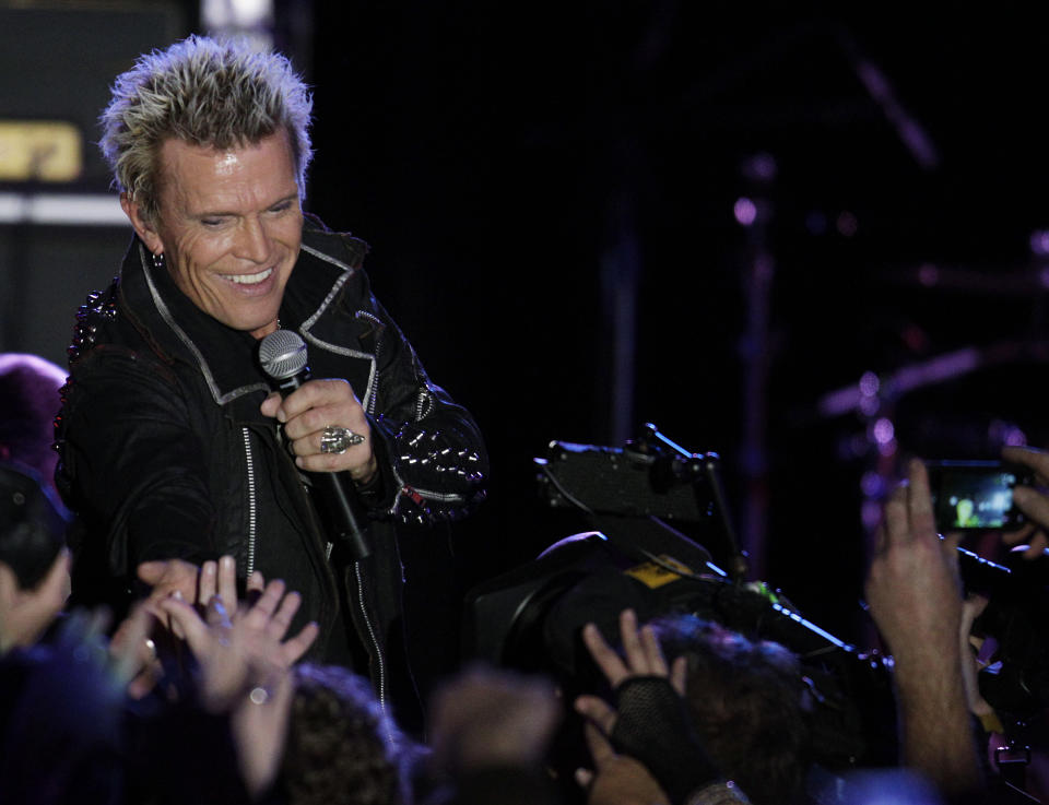 Billy Idol performs Friday, Oct. 26, 2012, in Seattle. Idol came to play in Seattle after Michael Henrichsen launched a two-year grass-roots campaign to convince the rock start to play for his birthday party. (AP Photo/Ted S. Warren)