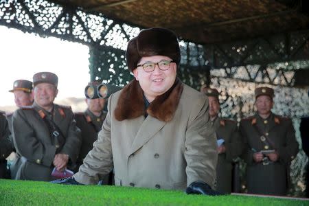 North Korean leader Kim Jong Un watches landing and anti-landing exercises being carried out by the Korean People's Army (KPA) at an unknown location, in this undated photo released by North Korea's Korean Central News Agency (KCNA) in Pyongyang on March 20, 2016. REUTERS/KCNA