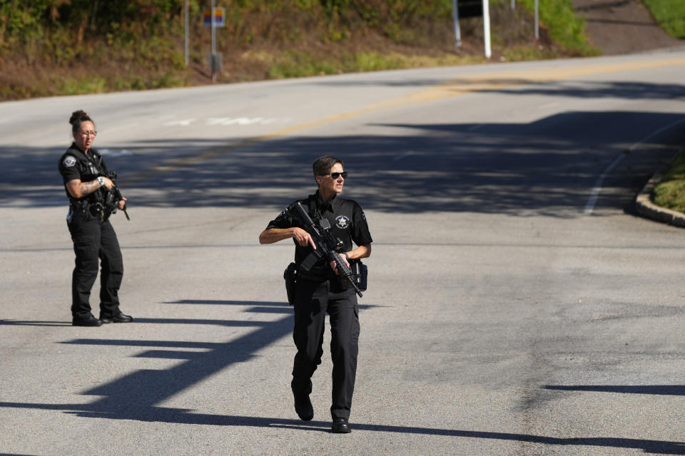 Law enforcement officers stand guard as the search for escaped convict Danelo Cavalcante continues in Pottstown, Pa., Tuesday, Sept. 12, 2023. (AP Photo/Matt Rourke)