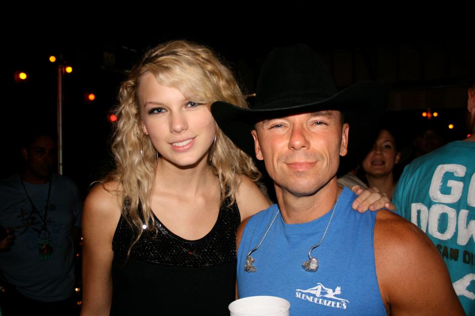 Kenny Chesney was an early champion of Taylor Swift (left), who praised Chesney in her recent Time magazine Person of the Year profile. Here, they hang at his show in June 2007 at Pizza Hut Park in Frisco, Texas.
