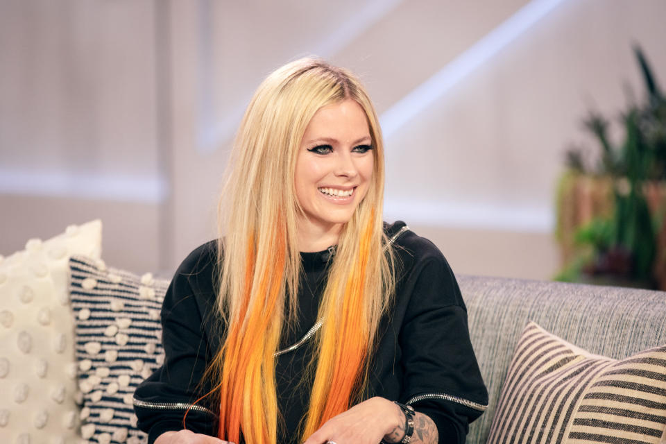 Avril Lavigne looks ‘breathtaking’ in pink Versace cardigan