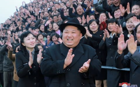 North Korean leader Kim Jong Un reacts as people applaud during his visit to the newly-remodeled Pyongyang Teacher Training College, in this photo released by North Korea's Korean Central News Agency (KCNA) in Pyongyang on January 17 - Credit: KCNA/REUTERS