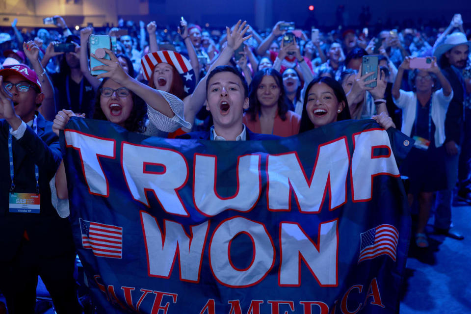 <div class="inline-image__caption"><p>People cheer as Trump arrives on stage during the Turning Point USA Student Action Summit in Tampa on July 23.</p></div> <div class="inline-image__credit">Joe Raedle/Getty</div>