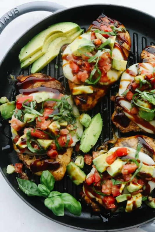 <p>The Recipe Critic</p><p>Grilled California avocado chicken is tender chicken marinated in an amazing honey garlic balsamic sauce and is grilled to perfection! Topped with a thick slice of mozzarella cheese and avocados, tomatoes, and basil, this chicken is incredible!</p><p><strong>Get the recipe: <a href="https://therecipecritic.com/grilled-california-avocado-chicken/" rel="nofollow noopener" target="_blank" data-ylk="slk:Grilled California Avocado Chicken;elm:context_link;itc:0;sec:content-canvas" class="link "><em>Grilled California Avocado Chicken</em></a></strong></p>