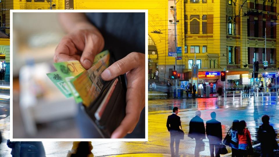 Pedestrians in Melbourne, hands holding Australian wallet with cash in it. 