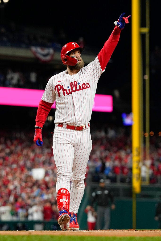 Philadelphia Phillies' Bryce Harper celebrates his two-run home run during the first inning in Game 3 of baseball's World Series between the Houston Astros and the Philadelphia Phillies on Tuesday, Nov. 1, 2022, in Philadelphia. (AP Photo/David J. Phillip)