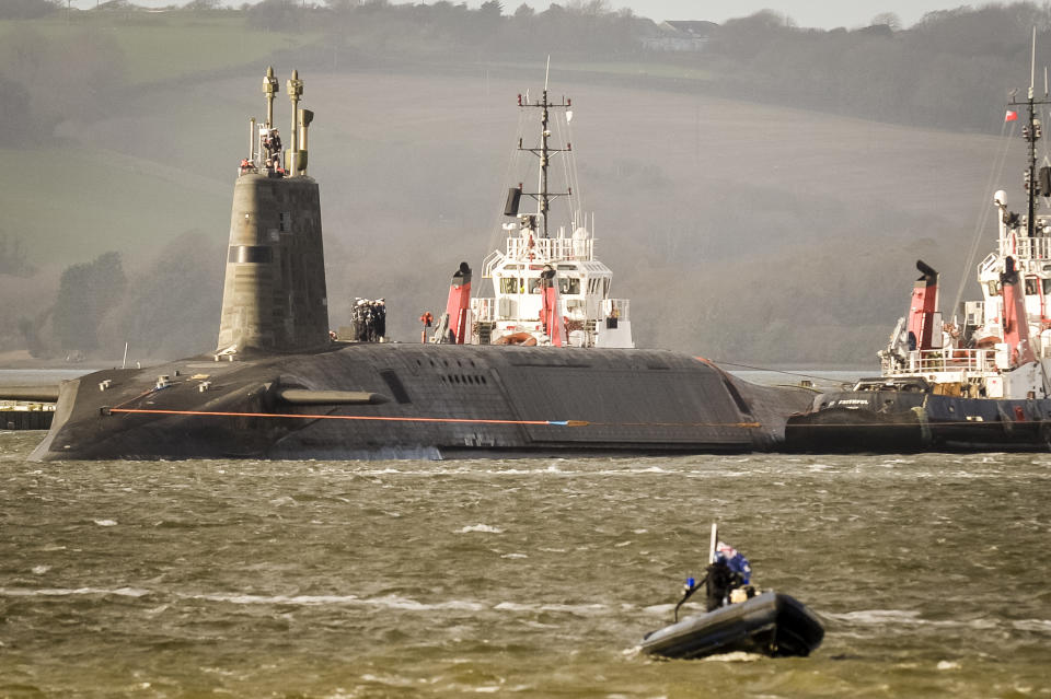 HMS Vengance, the V-Class UK nuclear deterrent submarine leaves the harbour at Devonport, Plymouth.