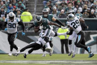 <p>Philadelphia Eagles running back Josh Adams (33) is tripped up by Carolina Panthers cornerback Donte Jackson (26) during the first half of an NFL football game, Sunday, Oct. 21, 2018, in Philadelphia. Panthers’ Treyvon Hester (90) and Avonte Maddox (29) help defend during the play. (AP Photo/Michael Perez) </p>