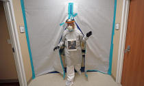 Dr. Joseph Varon walks through the Coronavirus Unit at United Memorial Medical Center, Monday, July 6, 2020, in Houston. Varon says he has worked more than 100 days with barely a rest and normally sleeps just a few hours a night. (AP Photo/David J. Phillip)