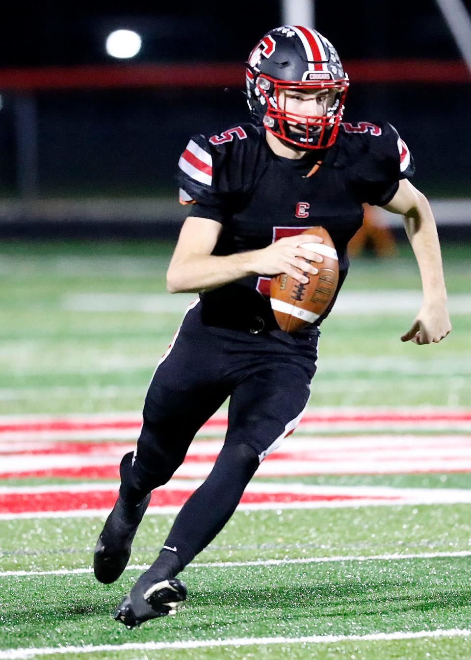 Crestview High School's Hayden Kuhn (5) carries the ball against Patrick Henry High School during the OHSAA Division VI second-round high school football playoff game at Scott Bailey Memorial Field Friday, Nov. 4, 2022. TOM E. PUSKAR/ASHLAND TIMES-GAZETTE