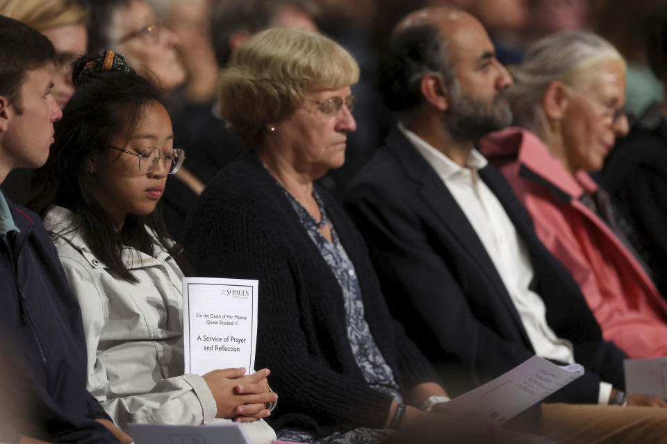 Members of the public attend a Service of Prayer and Reflection, following the passing of Britain's Queen Elizabeth II, at St Paul's Cathedral in London, Friday Sept. 9, 2022. (Paul Childs/Pool via AP)