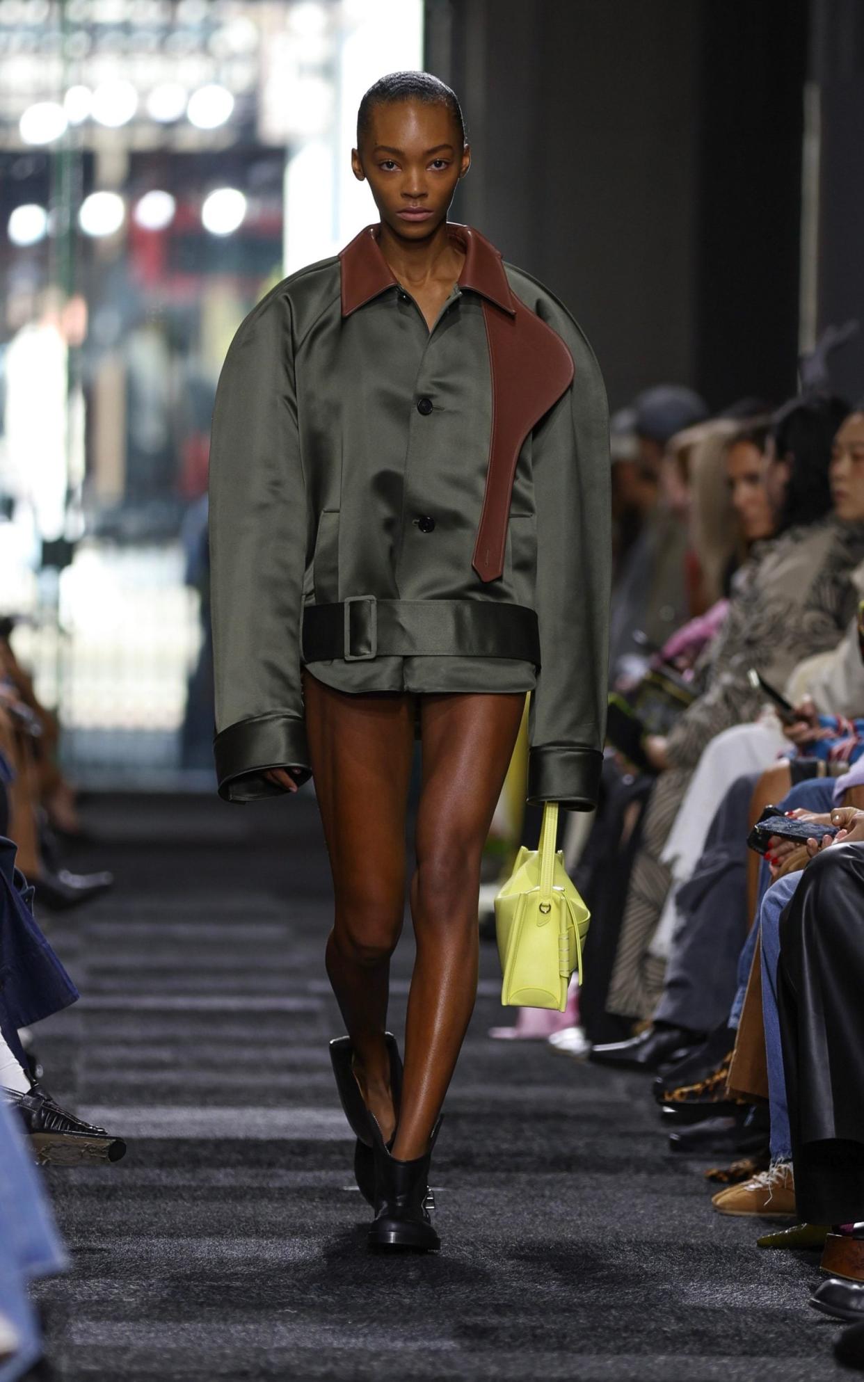 A khaki satin bomber jacket featured in the JW Anderson show