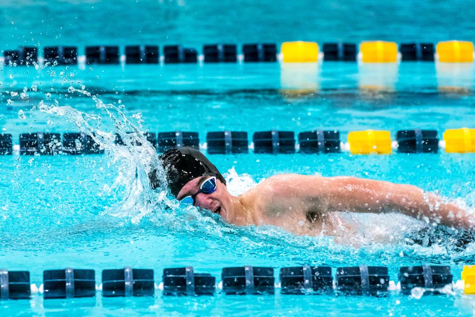 Liam Earl set the 100 backstroke record at the 2022 Div. 1 State championship.