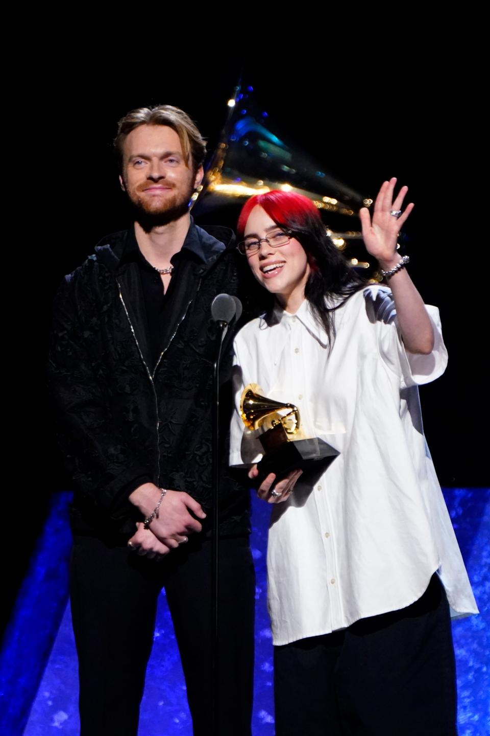 Billie Eilish, right, and brother Finneas O'Connell accept best song written for visual media for "What Was I Made For?" (from "Barbie").
