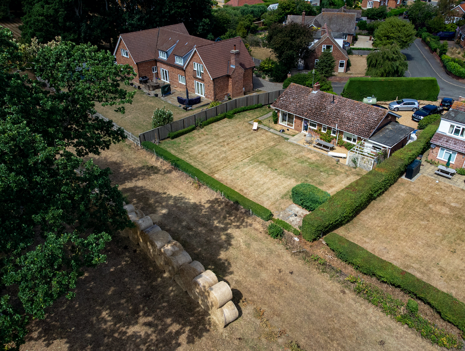 The hay wall replaced trees that were cut down. (SWNS)