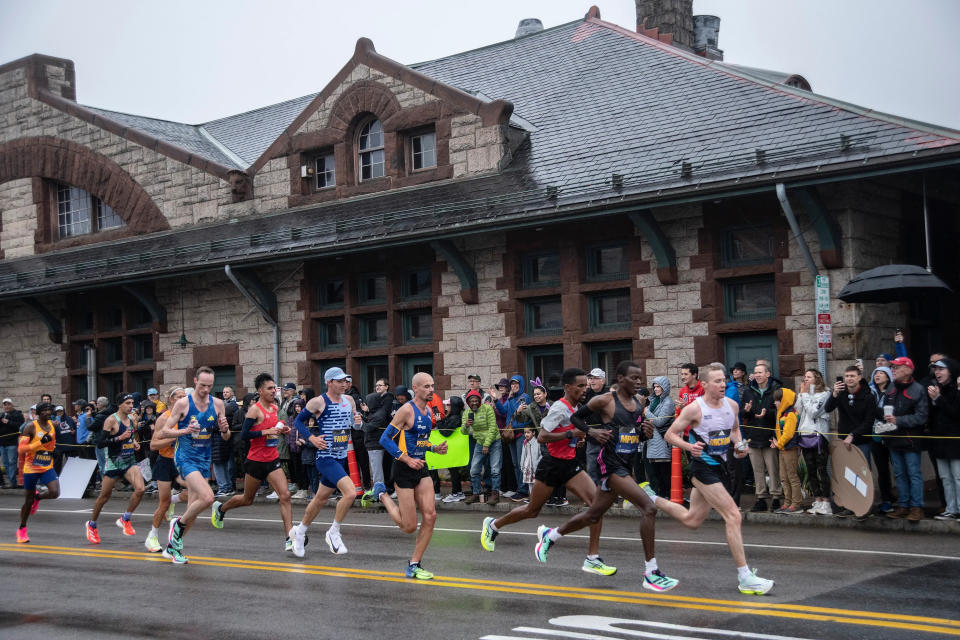 Elite men's runners battle for position as they pass the Framingham train station building on Waverly Street (Route 135) in last year's Boston Marathon. Waverly Street in Framingham will be closed to motor-vehicle traffic beginning at 7:30 a.m. on Marathon Monday.