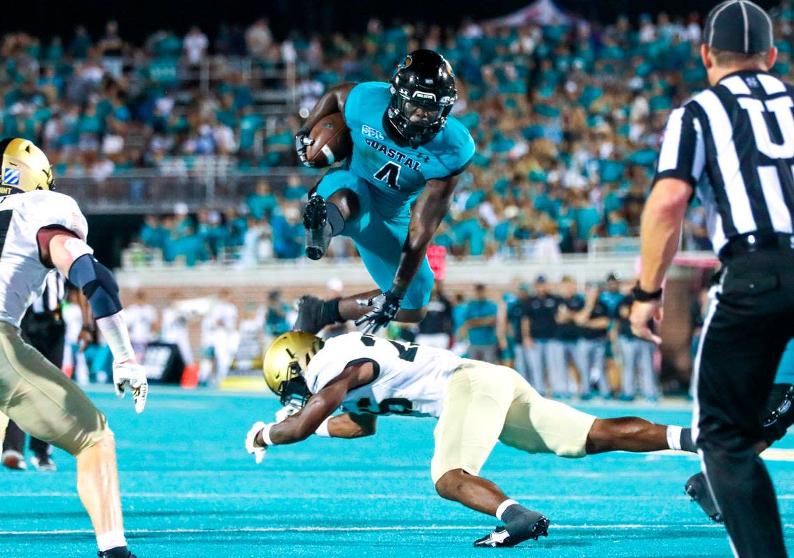 C.J. Beasley gets airborne jumping over Army on Saturday evening. Coastal Carolina University beat Army in the first game of the 2022 season at Brooks Stadium in Conway 38-28. Sept. 3, 2022.