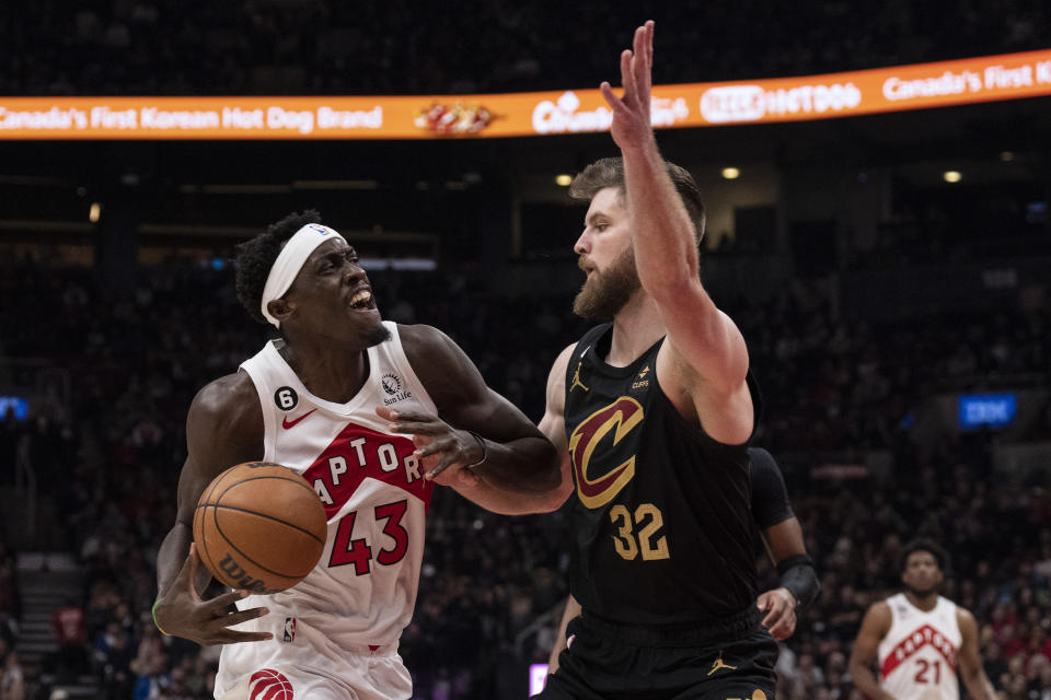 Toronto Raptors' Pascal Siakam (43) drives at Cleveland Cavaliers' Dean Wade during the first half of an NBA basketball game in Toronto, Monday, Nov. 28, 2022. (Chris Young/The Canadian Press via AP)