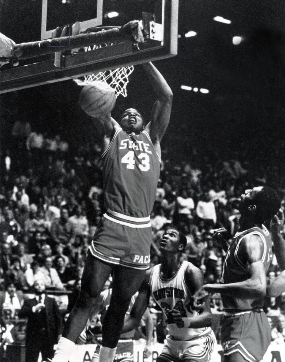 NC State player Lorenzo Charles dunks the winning shot at the buzzer to win the 1983 NCAA National Championship.