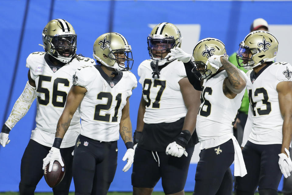 New Orleans Saints cornerback Patrick Robinson (21) celebrates with teammates after intercepting a pass in the end zone during the first half of an NFL football game against the Detroit Lions, Sunday, Oct. 4, 2020, in Detroit. (AP Photo/Duane Burleson)