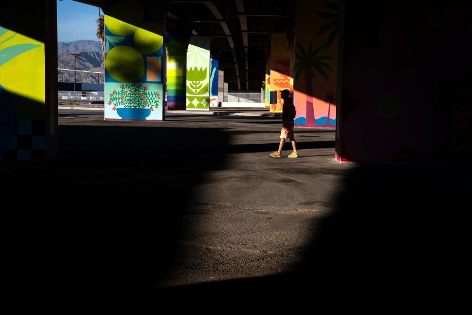 Robert Kwok of Rancho Mirage attends the unveiling event for the murals at the Jackson Street Bridge in downtown Indio, Calif.